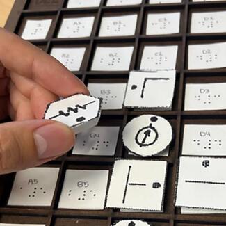 A resistor tile being added to a circuit design on the hardware grid board, which is part of the IncluSim tool. Aya Mouallem photo.