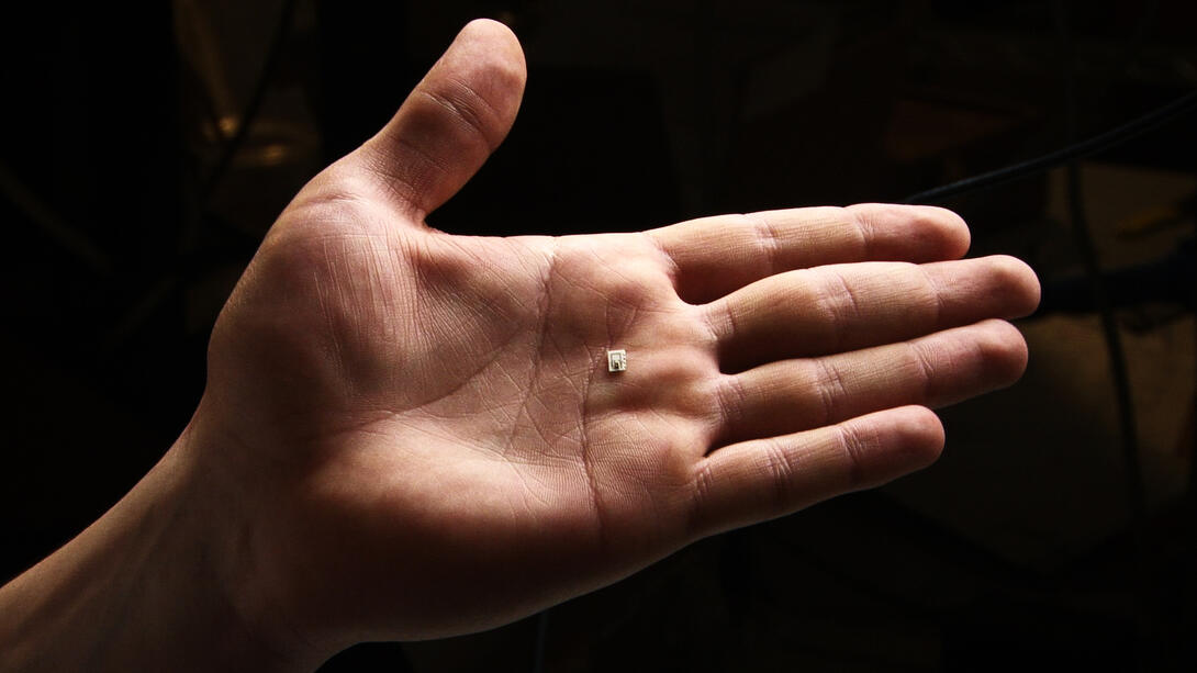 hand with microprocessing chip